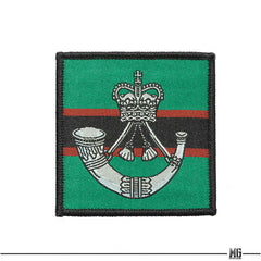 Embroidered unit ID patch with teal panel, red stripe, crest emblem, black border